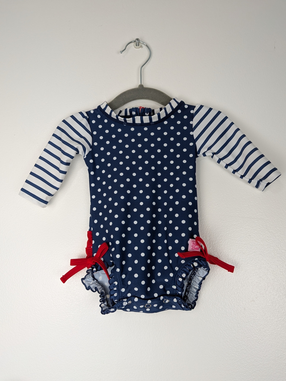 Ruffle Butts Navy Polka Dot Long-Sleeve Swim Top with White Stripes